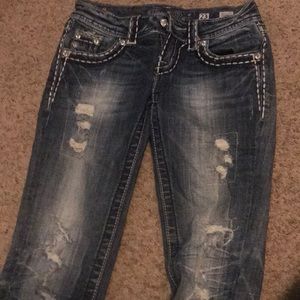 Single worn Miss Me Jeans.